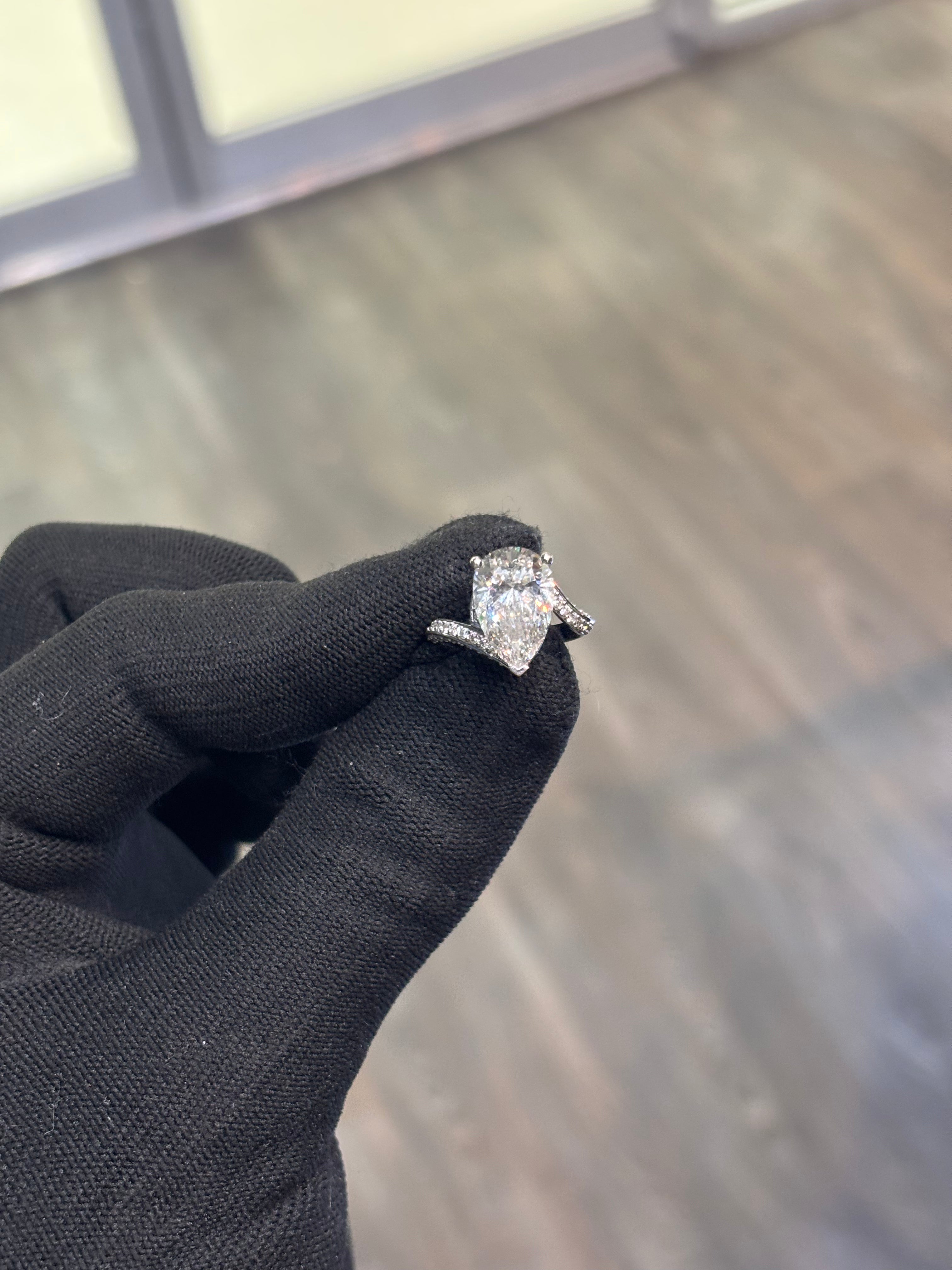4 CARAT PEAR SHAPE DIAMOND RING
